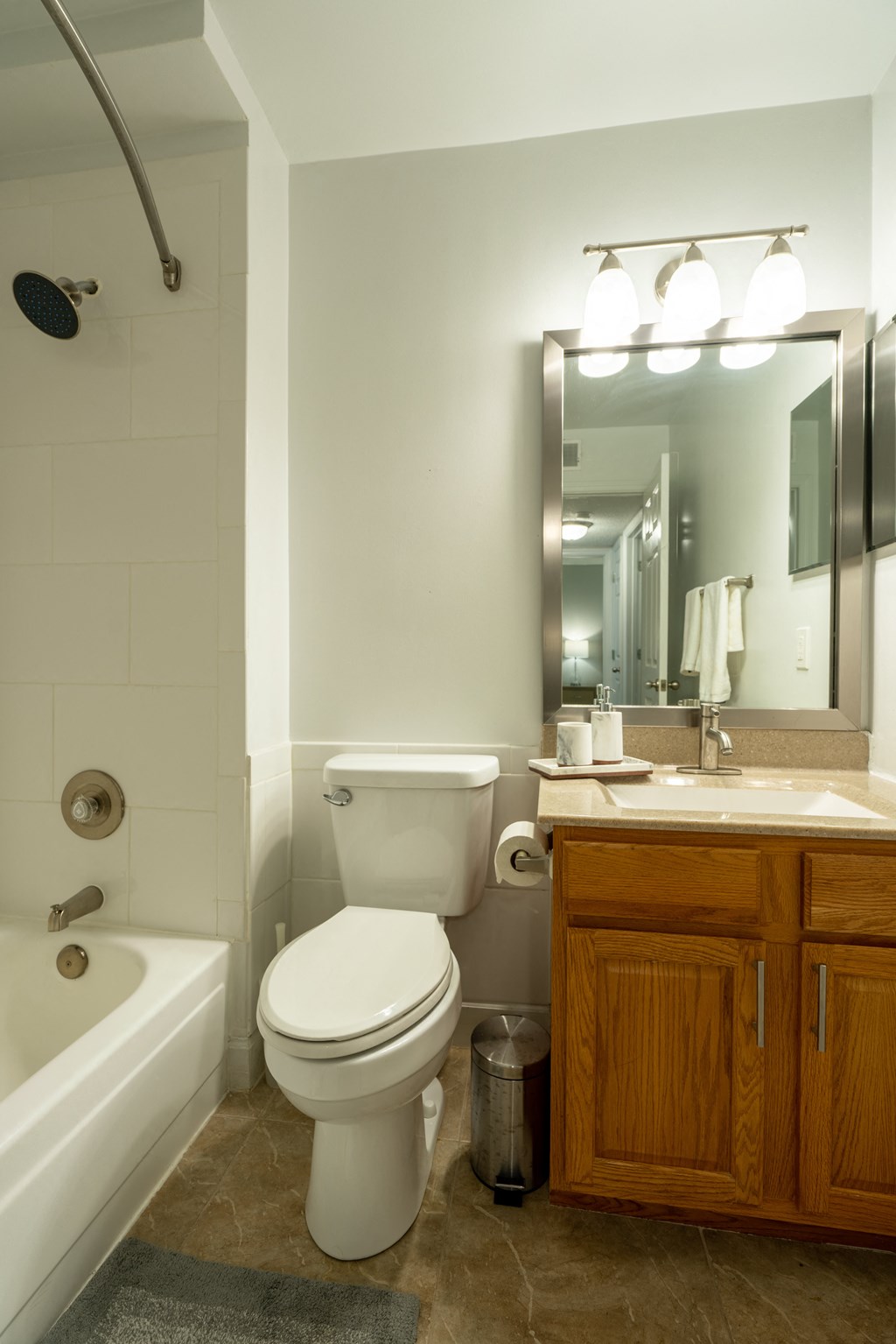 a bathroom with a toilet and a sink and a bath tub