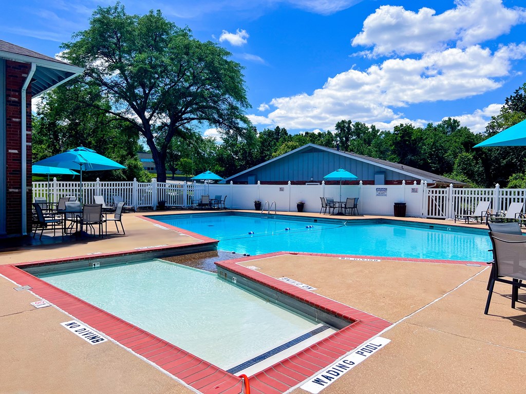 A swimming pool with a red and white striped edge.