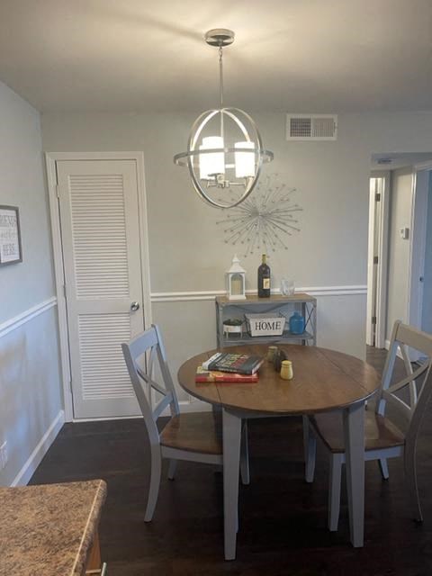 a dining room with a table and chairs