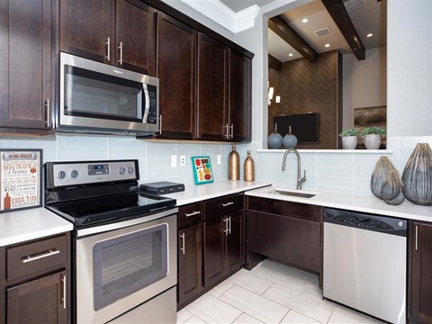 a kitchen with a stove and a microwave