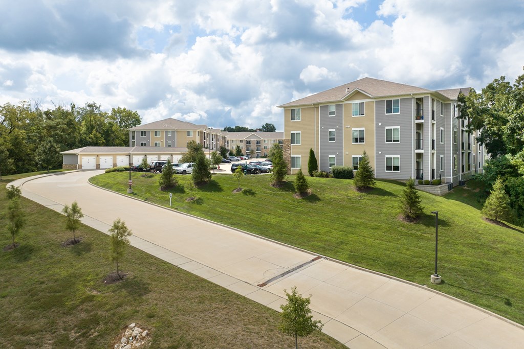 A large building with a parking lot in front of it.