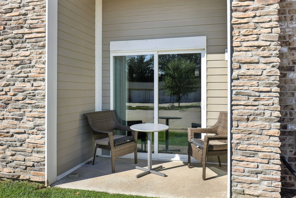 A patio with a table and chairs is shown.