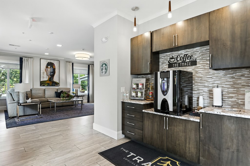 A modern living room with a coffee machine and a sofa.