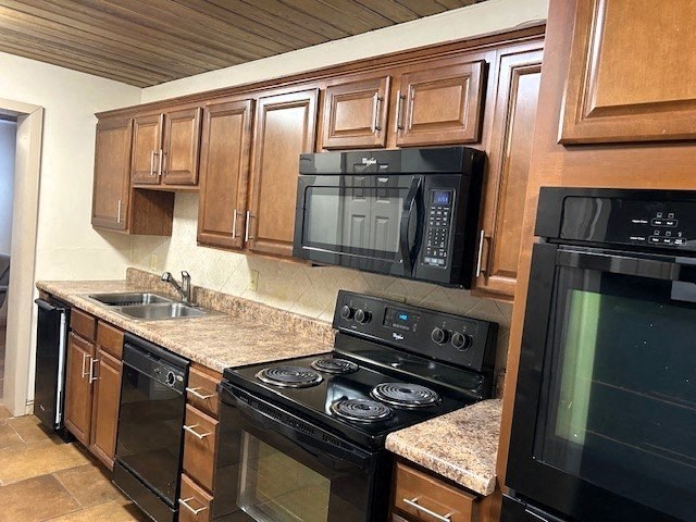 a kitchen with a stove microwave and sink