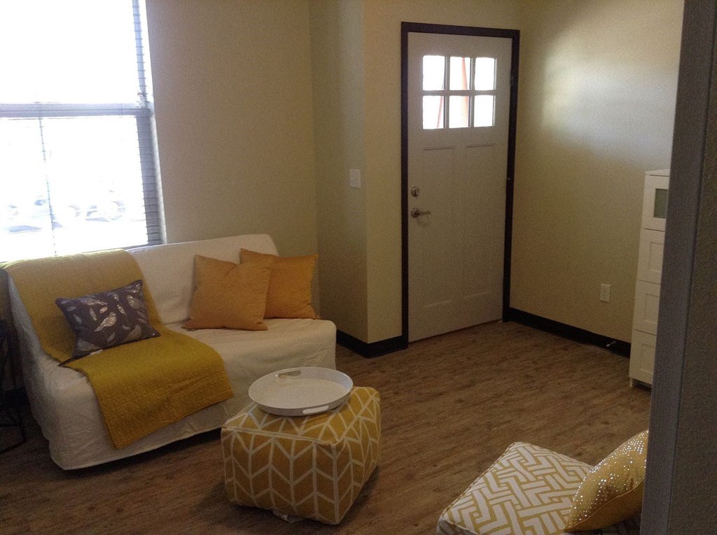 a living room with a couch and a table