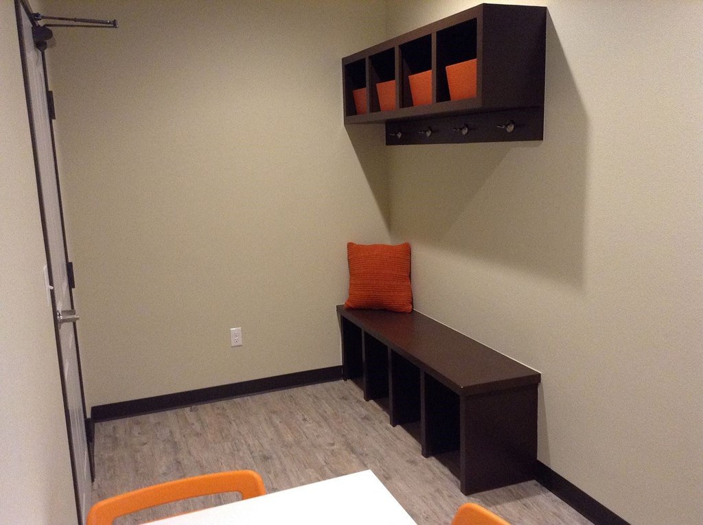 a small study area with a desk and a chair