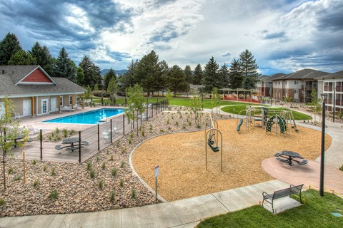 Clubhouse, pool, and playground at Village on Plum