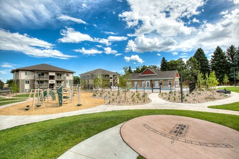 Outdoor common space and playground at Village on Plum