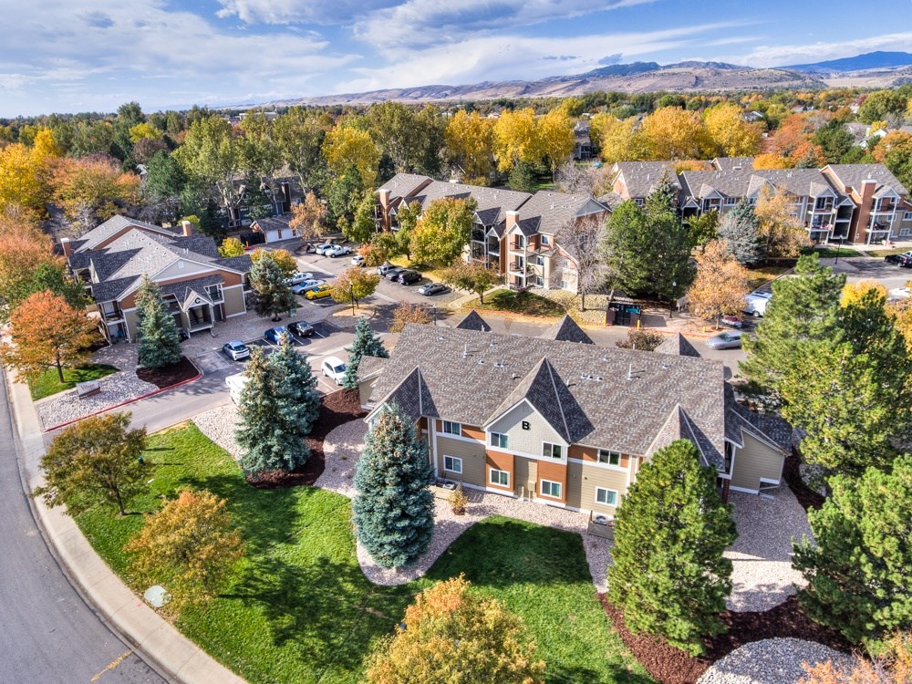 A bird's eye view of a residential area with houses and trees.