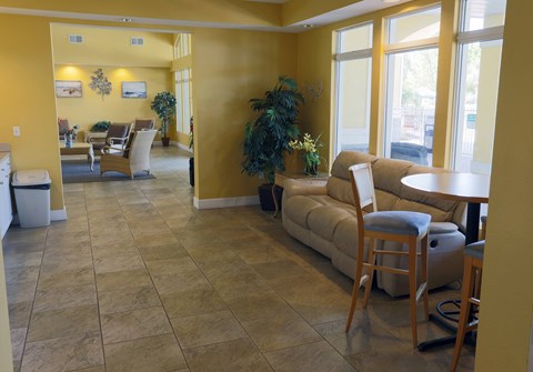 a living room with a couch and a table