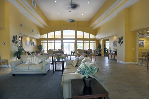 a large living room with couches and a coffee table