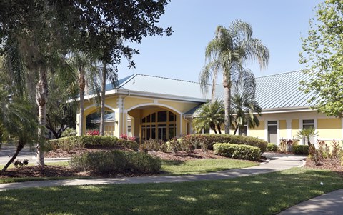 a building with palm trees in front of it