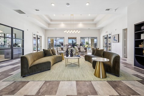 A modern living room with a large sectional sofa and a coffee table.