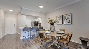 a dining room and kitchen with a table and chairs  at Highland Luxury Living, Lewisville, 75067