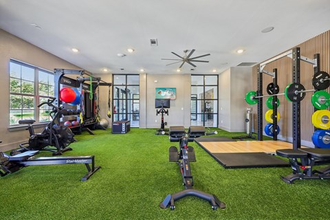 A well-equipped home gym with a variety of exercise equipment.