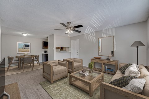 A living room with a couch, chair, and coffee table.