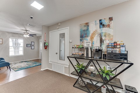 A room with a coffee time sign on the wall.