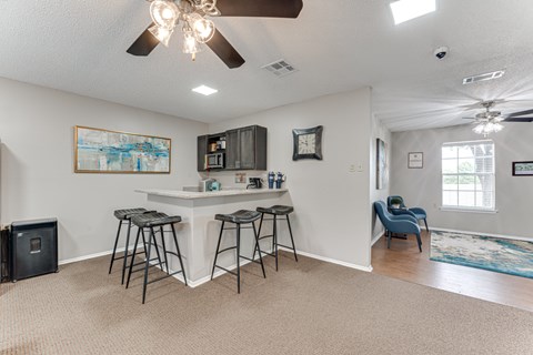 A room with a bar and a chair.