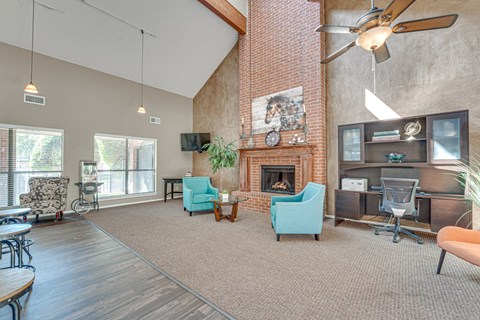A living room with a fireplace and a television.