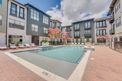 Resort style swimming pool with sundeck at The Barton Apartments, Dallas