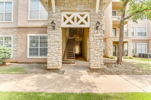 A stone building with a wooden entrance. at The Brazos, Dallas