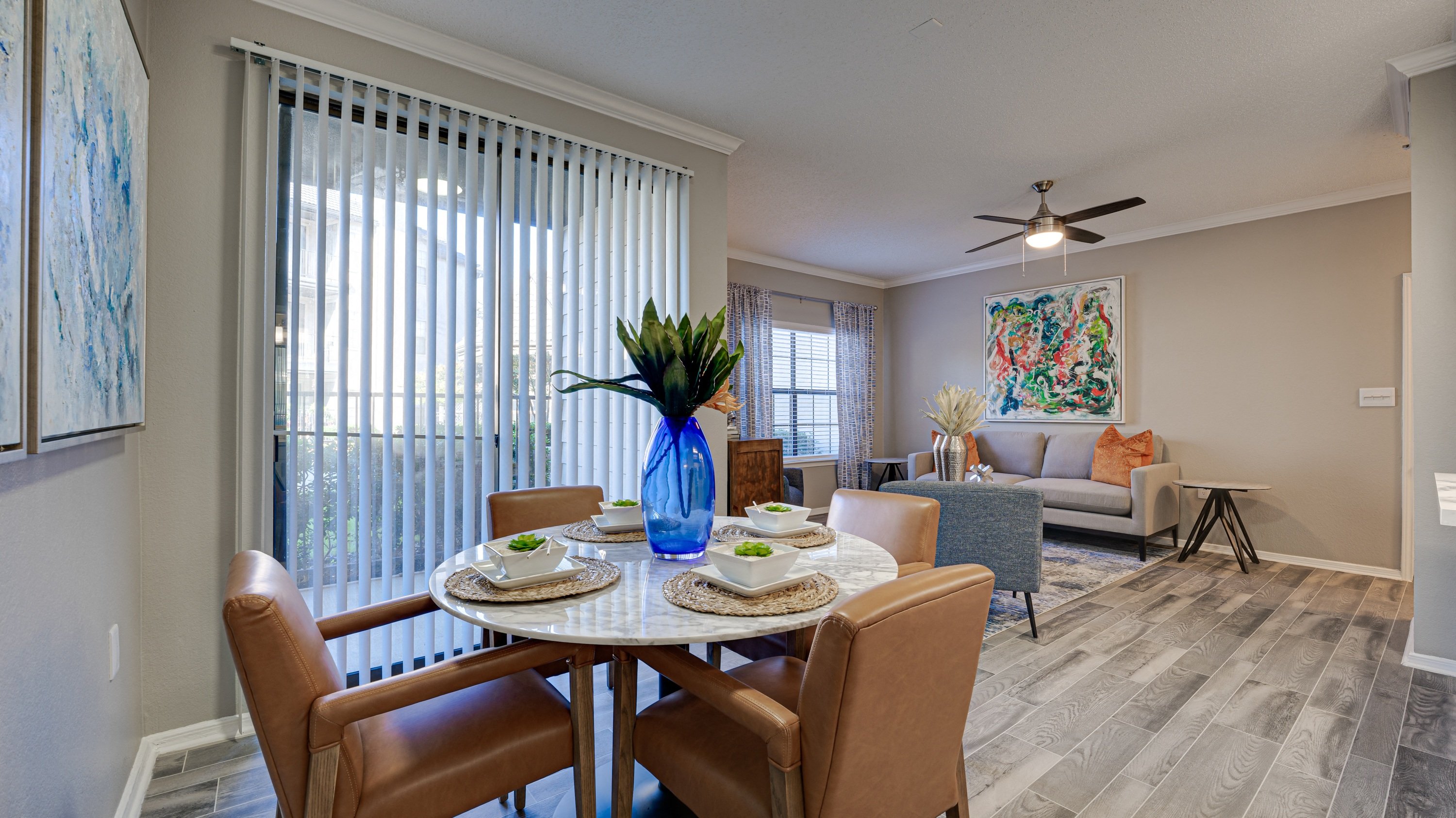 an open living room and dining room with a table and chairs