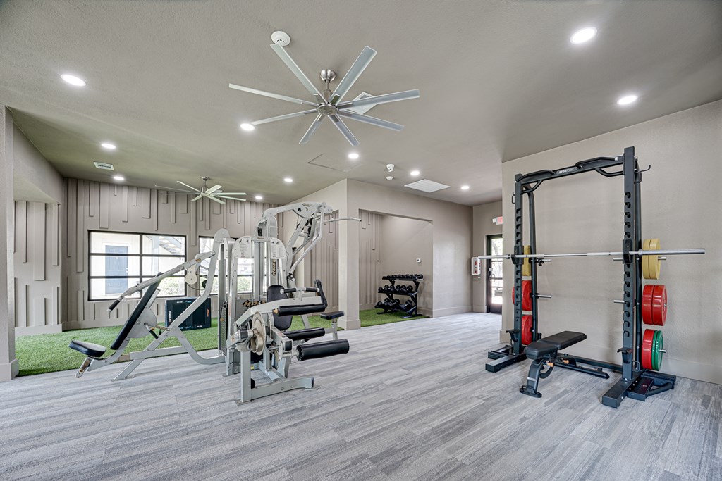 take advantage of the fitness center in the clubhouse at the enclave at woodbridge apartments in sugar  at Carmel Creekside, Texas