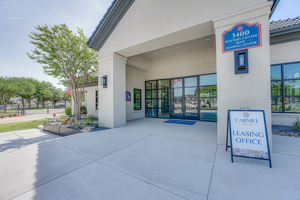 a leasing office with a sign that says carroll leasing office  at Carmel Creekside, Texas, 76137