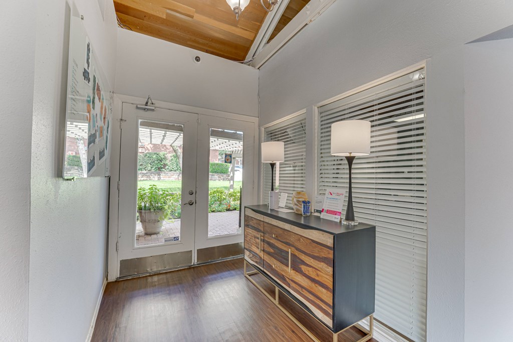A room with a wooden ceiling and a black and brown cabinet at Copper Hill Apartments, Bedford 76021