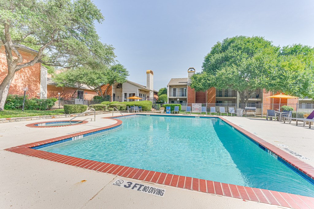 A large swimming pool with the depth marked 3FT at Copper Hill Apartments, Bedford, Texas