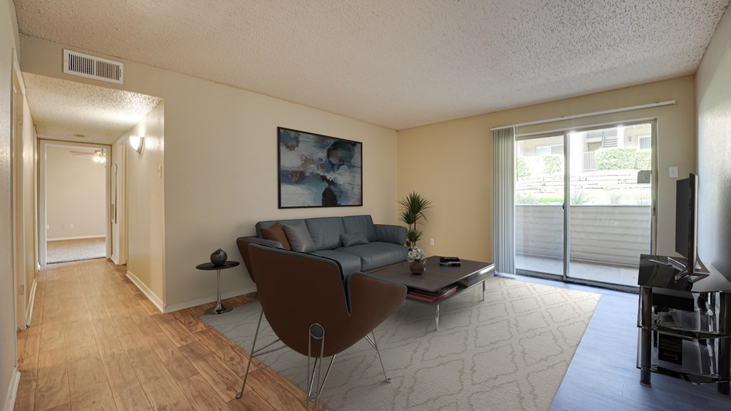 A living room with a brown chair and a grey couch at Copper Hill Apartments, Texas, 76021