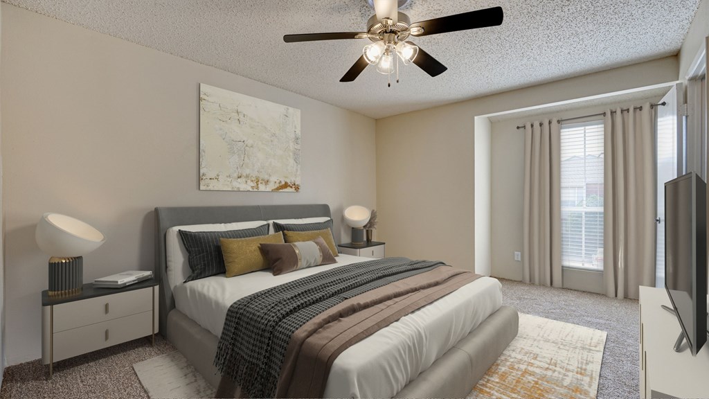 A bedroom with a large bed, a ceiling fan, and a painting on the wall at Copper Hill Apartments, Bedford 76021