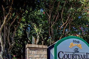 Entrance to The Courtyard Apartments Main entrance to The Courtyard Apartments in Garland TX - Photo Gallery 4