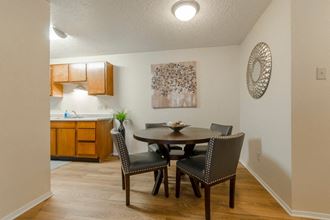 dining room with wood flooring and ceiling light  at Arbors Of Cleburne, Cleburne, TX