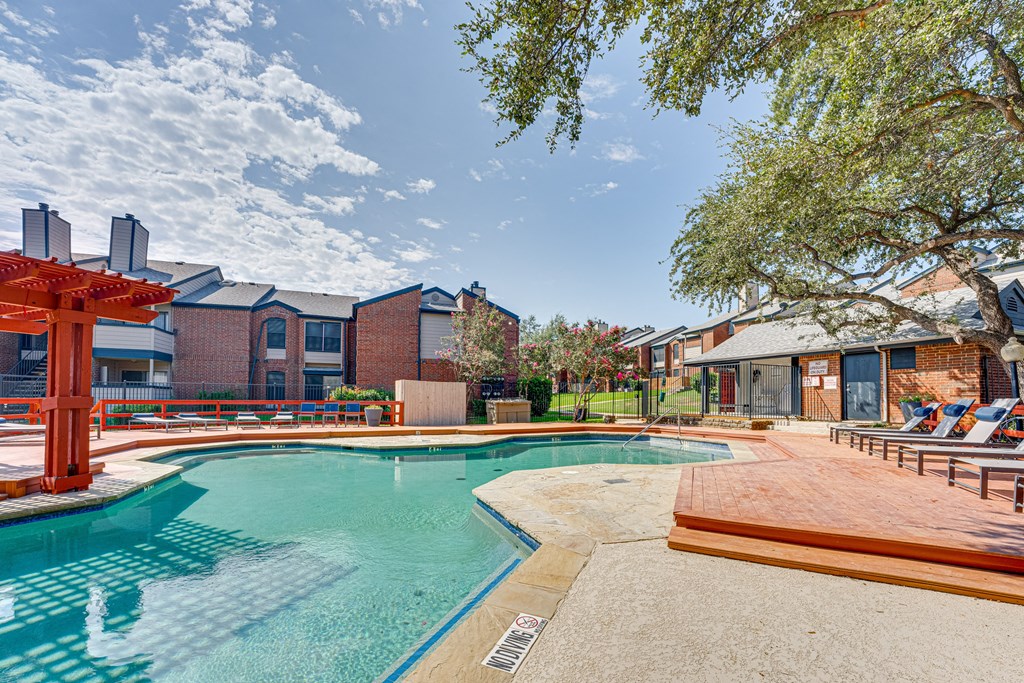 our apartments at the district feature a swimming pool at Indian Creek Apartments, Carrollton, TX, 75007