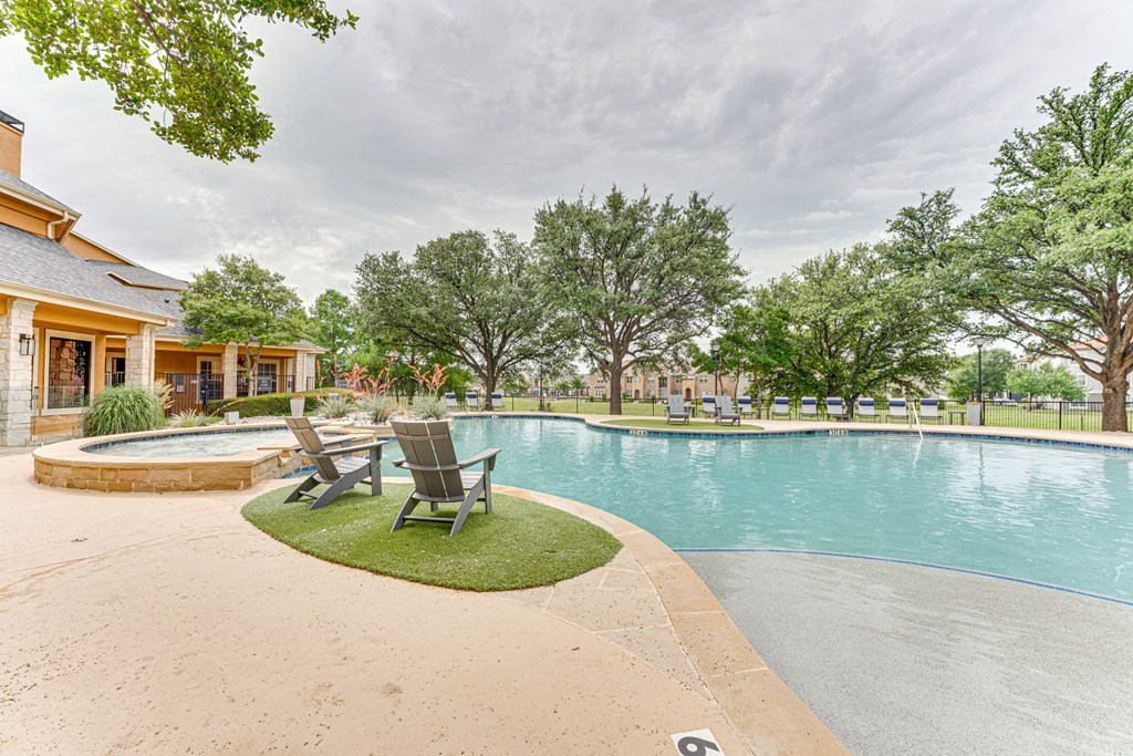 A swimming pool with a number 6 on the ground at Limestone Ranch Apartments, Lewisville, TX