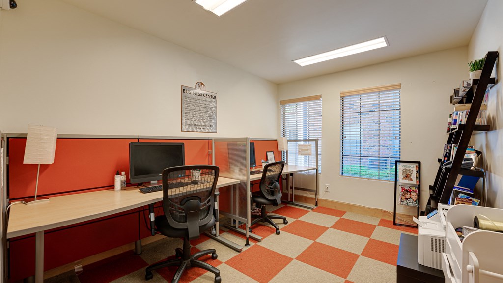 Living room areaa home office with a desk and a computer