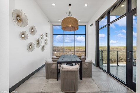 A modern dining room with a view of the outdoors.
