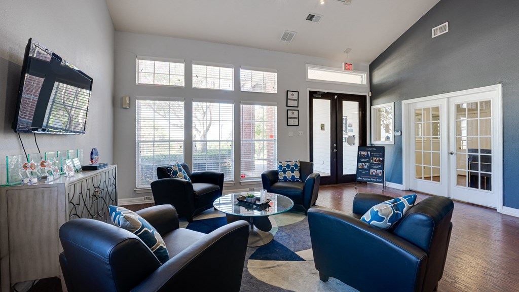 a living room with couches and chairs and a tv at Paces Crossing, Denton, 76210