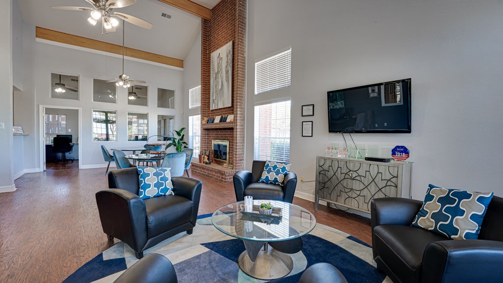 a living room with couches and a table and a television at Paces Crossing, Denton