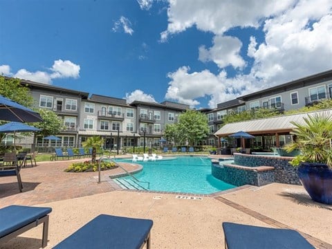 Swimming Pool With Lounge Chairs at Highline Urban Lofts, Cypress, TX, 77429