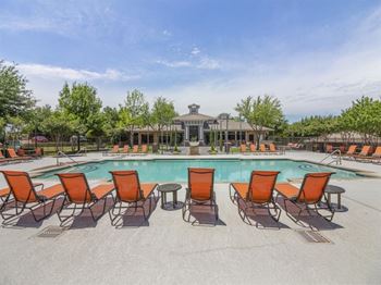 Poolside Sundeck With Relaxing Chairs  at Cypress Apartments, Texas
