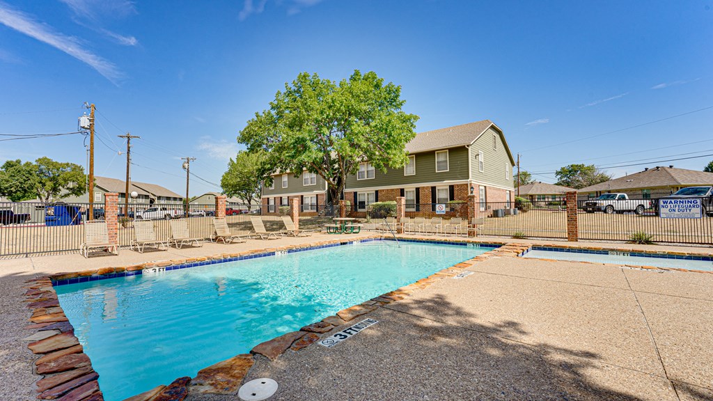 second pool with lounge seating  at Arbors Of Cleburne, Texas