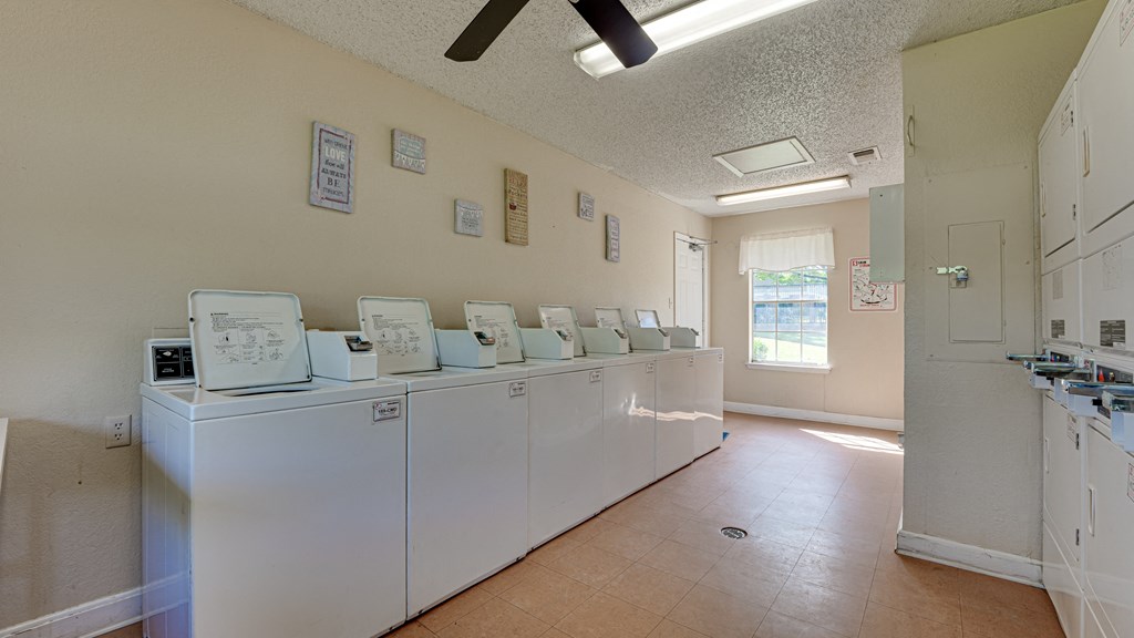 Laundry room with plenty of washers and dryers  at Arbors Of Cleburne, Texas, 76033