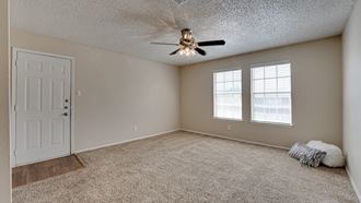 Spacious living room with carpet  at Arbors Of Cleburne, Cleburne, 76033