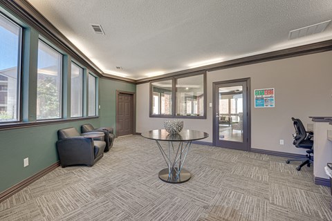 A room with a table and chairs in it.