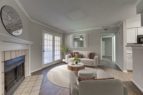 A living room with a fireplace and a couch.