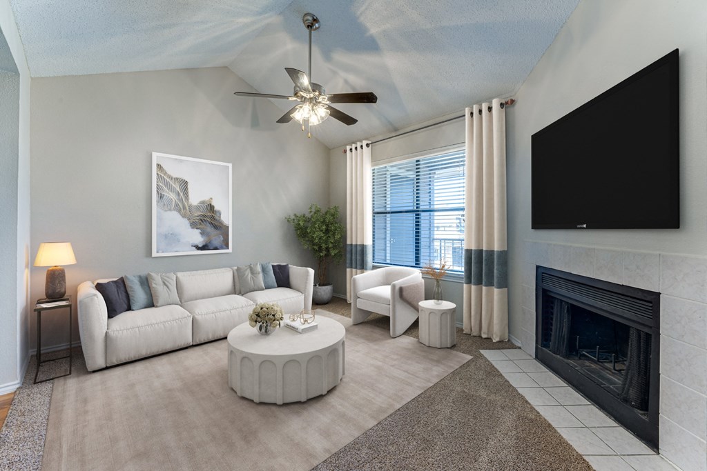 A living room with a fireplace and a television. at Towne Centre Village, Mesquite, TX, 75150