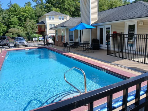 A blue pool with a ladder in the middle of it.