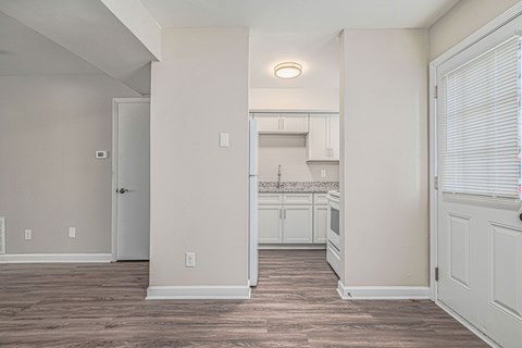 A kitchen area with a countertop and cabinets.